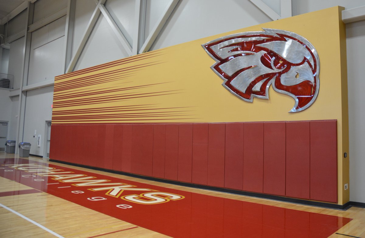 CoeCollege's tweet photo. Kohawk spirit will soar when students, faculty and fans see the new crimson and metal sculpture that has been installed in Kohawk Arena. Local artist, Josh Baker, created the custom piece that will maintain a watchful eye over Kohawk events. #KohawkEnhancements https://t.co/RAlmj5sjWu