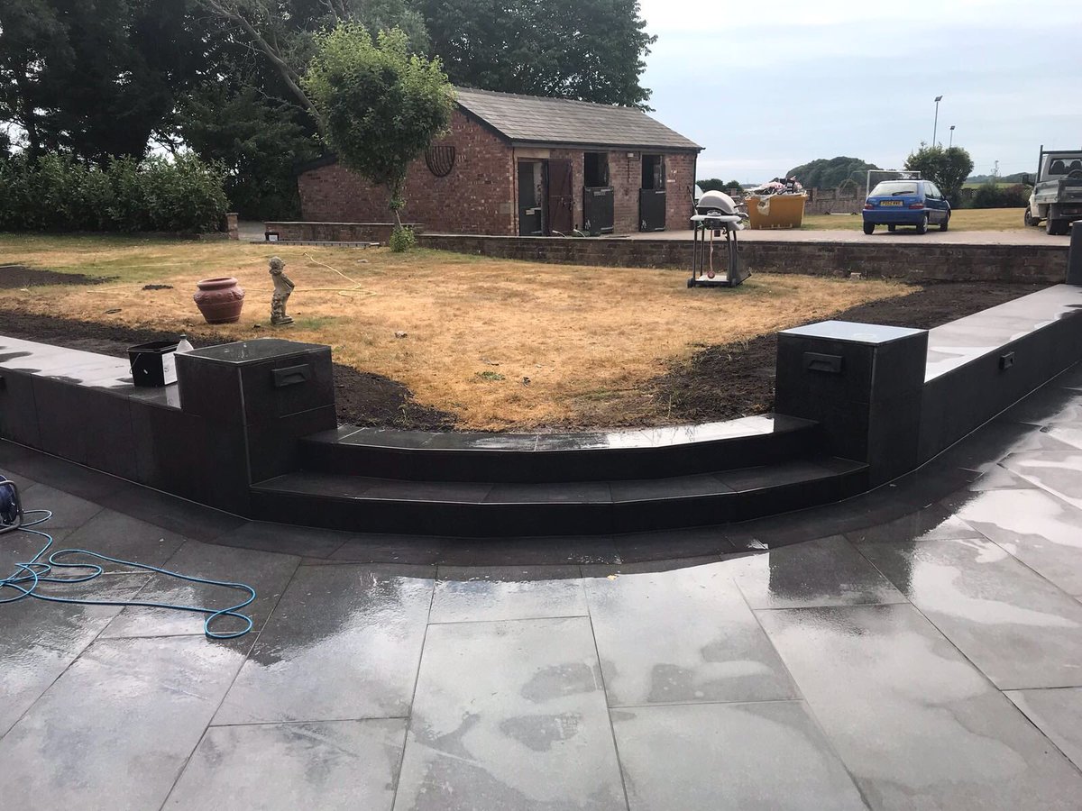 Our latest project, featuring Marshalls Symphony in basalt, with a dark plank edging. Matching paving as cladding on existing walls and pillars @MarshallsReg @dhmidm <a href="/WriggersK/">Keith Wrigley</a> @MarshallsGroup