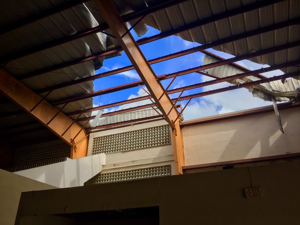FeelingFisky's tweet image. Was helping clean a building today when I looked up to this: the metal roof ripped apart like paper in 2 places.

The scars from Hurricane Maria are everywhere here, both physically &amp;amp; emotionally. My heart hurts so much for all that my island has endured and continues to endure.