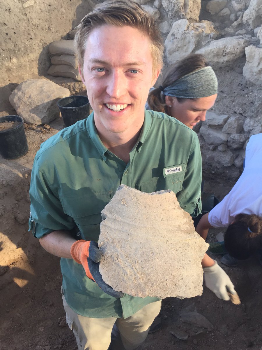 Chris Chandler of Asbury Theological Seminary holds one of the broken Iron I pithoi where you can see the wavy band decoration. Carbon-14 dates this destruction to the 10th century BCE.