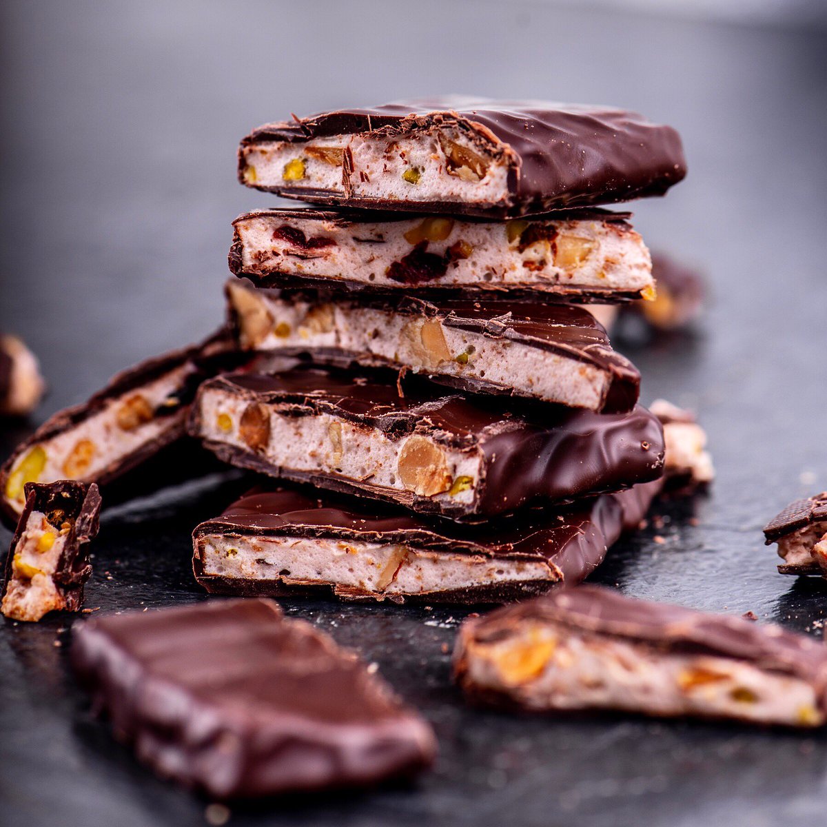 Rocky Road - when 54% dark chocolate meets handcrafted marshmallow, crushed nuts, cranberries and coconut!