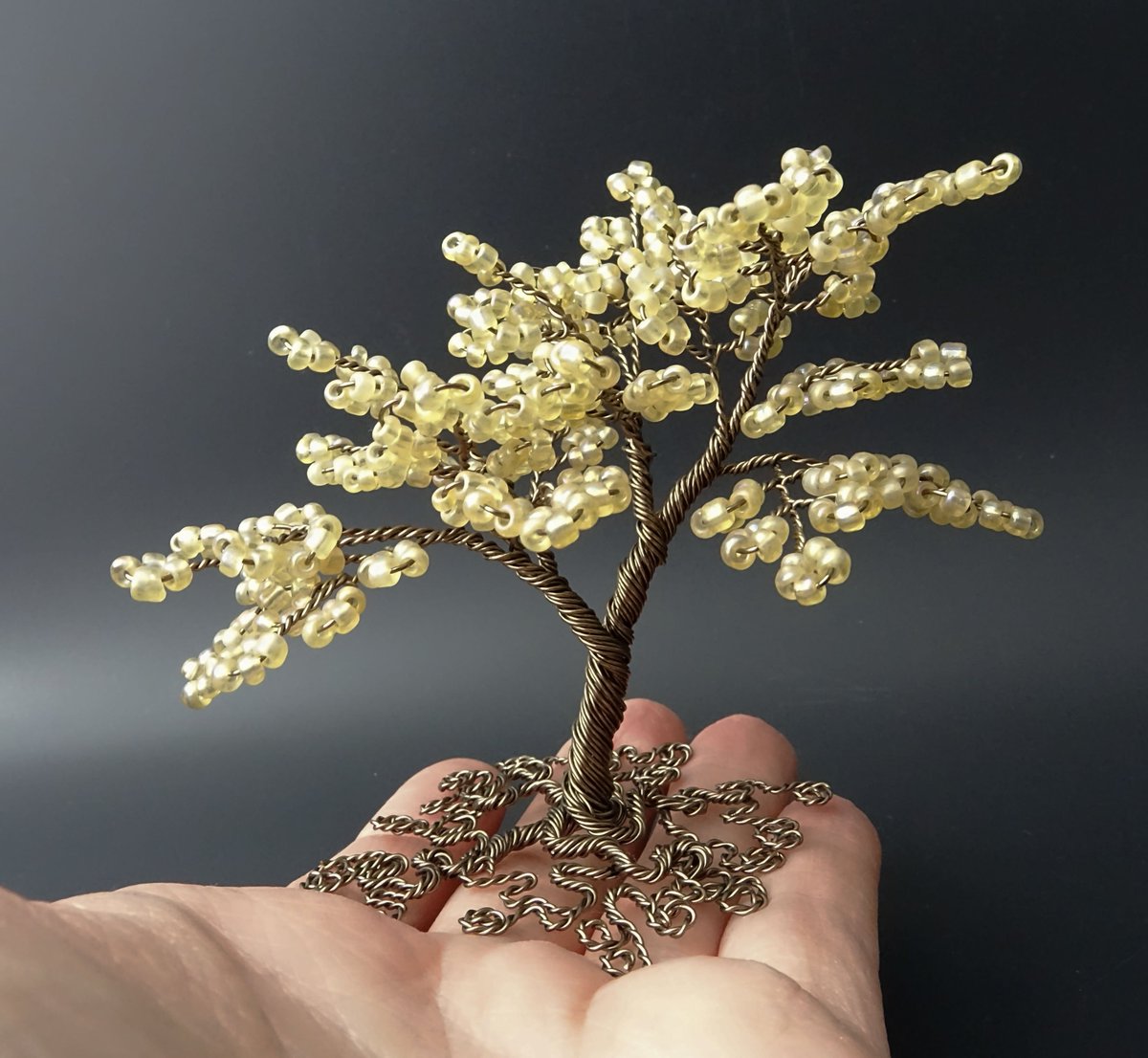 Honey coloured bead and gunmetal coloured copper wire tree of life