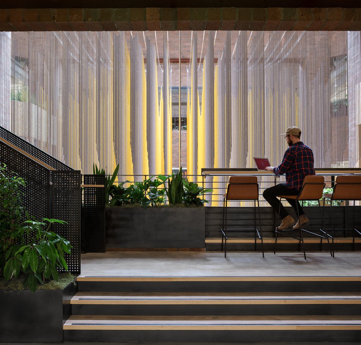 Our new office for @airbnb #Seattle.  1970s brick meets modern work environment, lush greenery, and a stunning #artinstallation by Rachel Mica Weiss. #workspacedesign #officedesign #interiors #architecture #seattledesign #pacificnorthwest #plantsarehealing