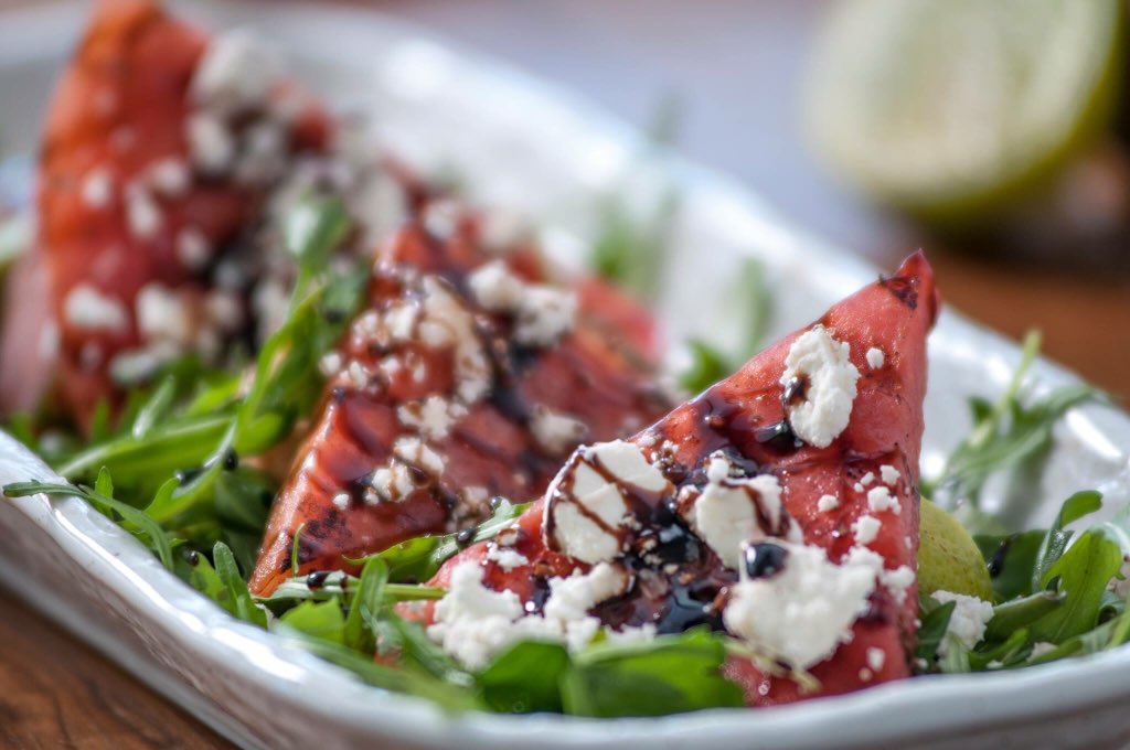 meatdistrictco's tweet photo. ‘Tis the season! #Watermelon season, that is! 🍉Grilled watermelon, arugula, and reduced balsamic with crumbled goat cheese is so refreshing in this #LA heat! 

Would you try this flavorful appetizer? 

#foodiela #foodporn #pasadena #pasadenaeats https://t.co/Vwg4FsNjJx