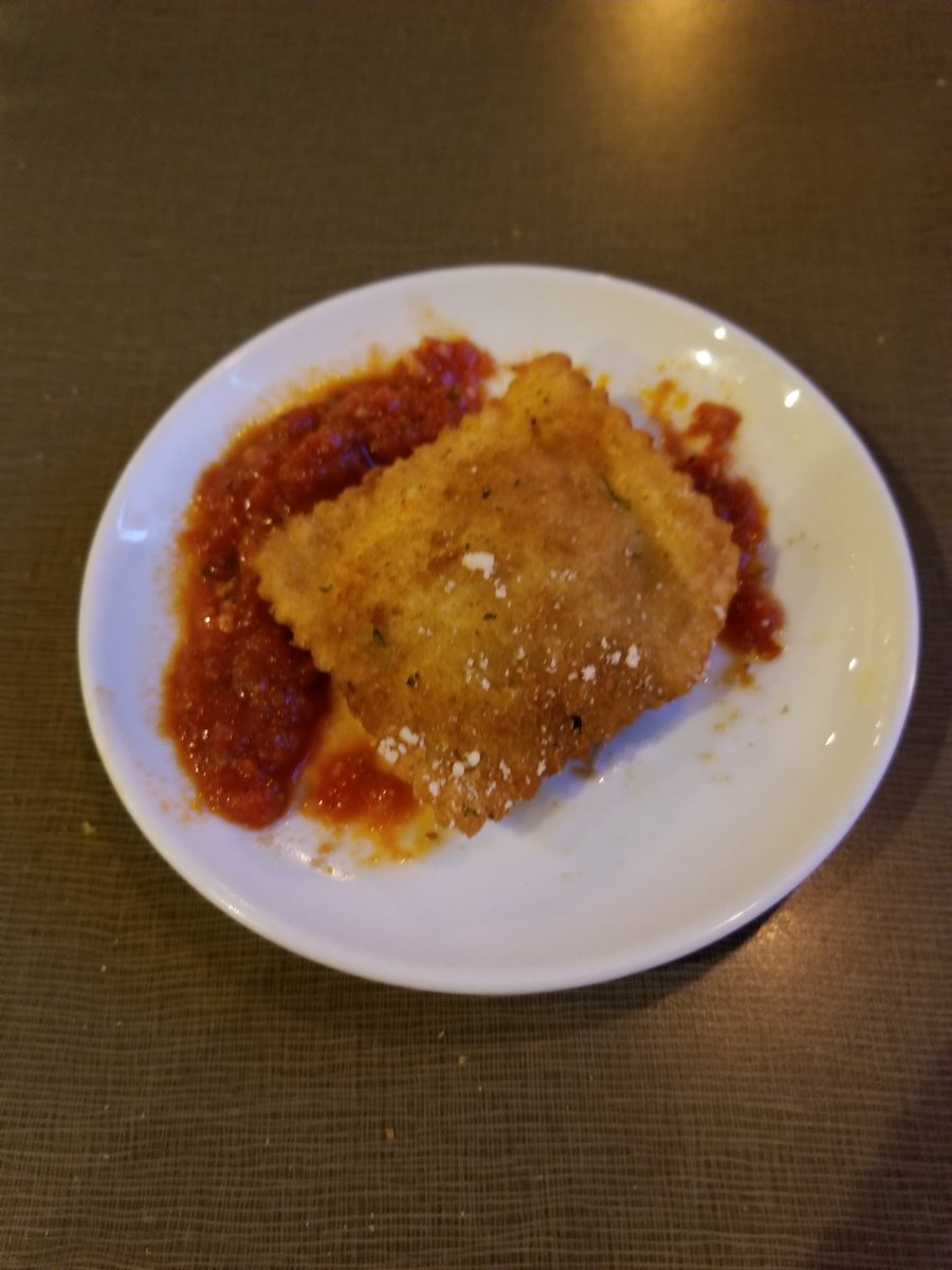 NathanielBradow's tweet photo. This tasty bit of heaven is a toasted ravioli from Anthonino's (authentic St. Louis fare). There is only one because I ate the others before it dawned on me how much others need to know about these! Both the ravioli and the sauce are knock out good! https://t.co/TKctqqNZtr