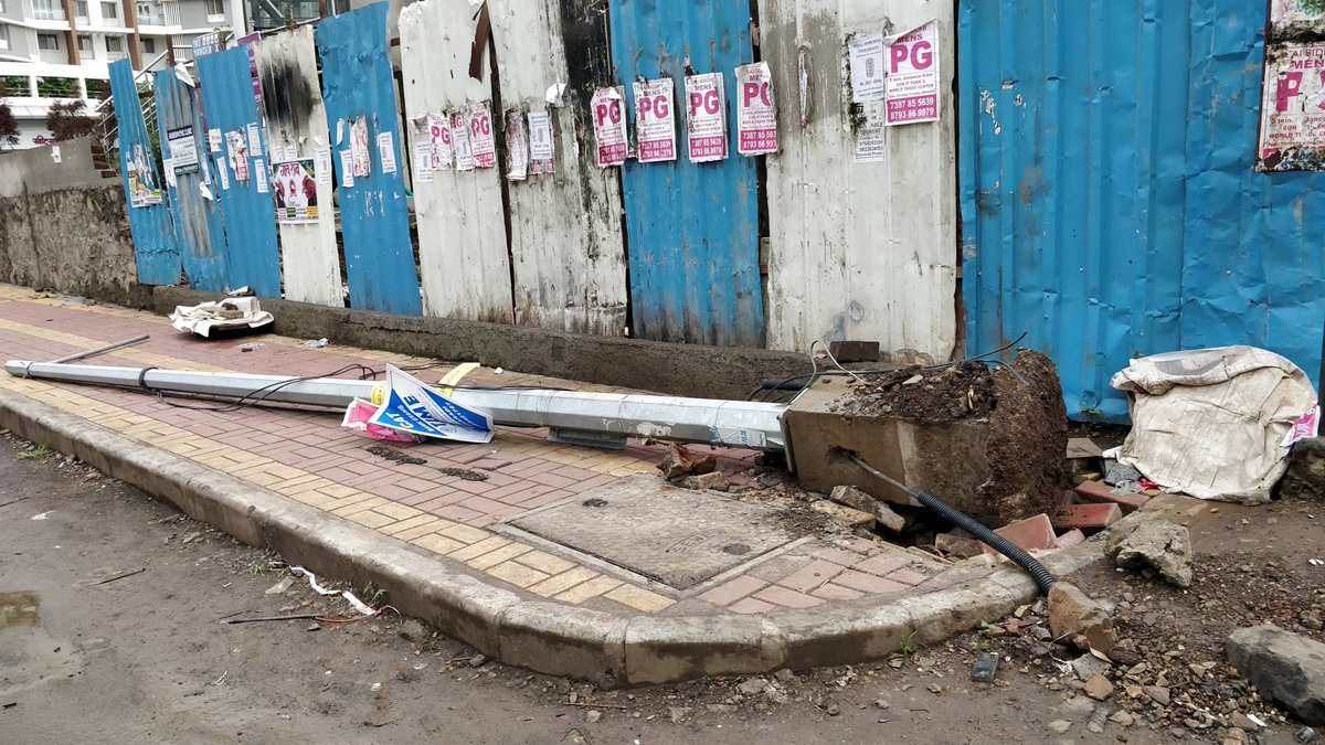 KhswaPune's tweet photo. @PMCPune @MSEDCL Street light Pole has fallen down due to Rain. Is the quality of mounting pole so cheap, 'cos of rain it should fall down?
Look at the base, only 1 feet support provided,no deep grounded support.
By god's grace no one is hurted. No street lights working further:( https://t.co/bjKGCA7jve