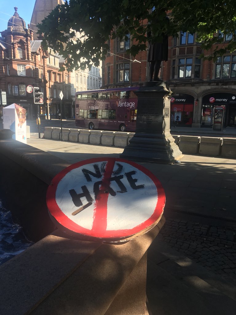 UPinBerlin's tweet photo. The city is still on Saturday morning. The sun shines on the silent remnants that remain from the #Trumpprotest in #Manchester

A sign without a protester still conveys its message, but do the protesters still speak their message? #nohate #nobigotry https://t.co/HsXkm7D5ks