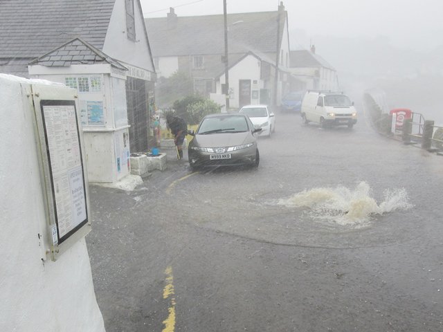 CornwallCouncil's tweet image. This time a year ago, heavy rain was starting to fall on the village of Coverack. Three hours later, @EnvAgencySW had recorded 103mm of rainfall - enough to fill the Royal Albert Hall four times over, or 86 Olympic-sized swimming pools ow.ly/HtYi30l0ocC