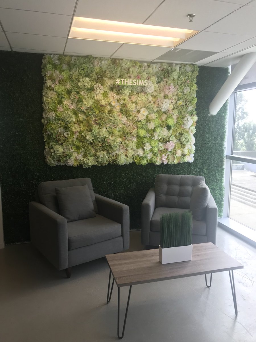 SimGuruiluore's tweet photo. Visited @EA LA. Looks like they reused the photo wall from @EAPlay  @TheSimsMobile @TheSims  booth for office decorations 🧐. #recycling #thesims. https://t.co/ZABhKFjSvt