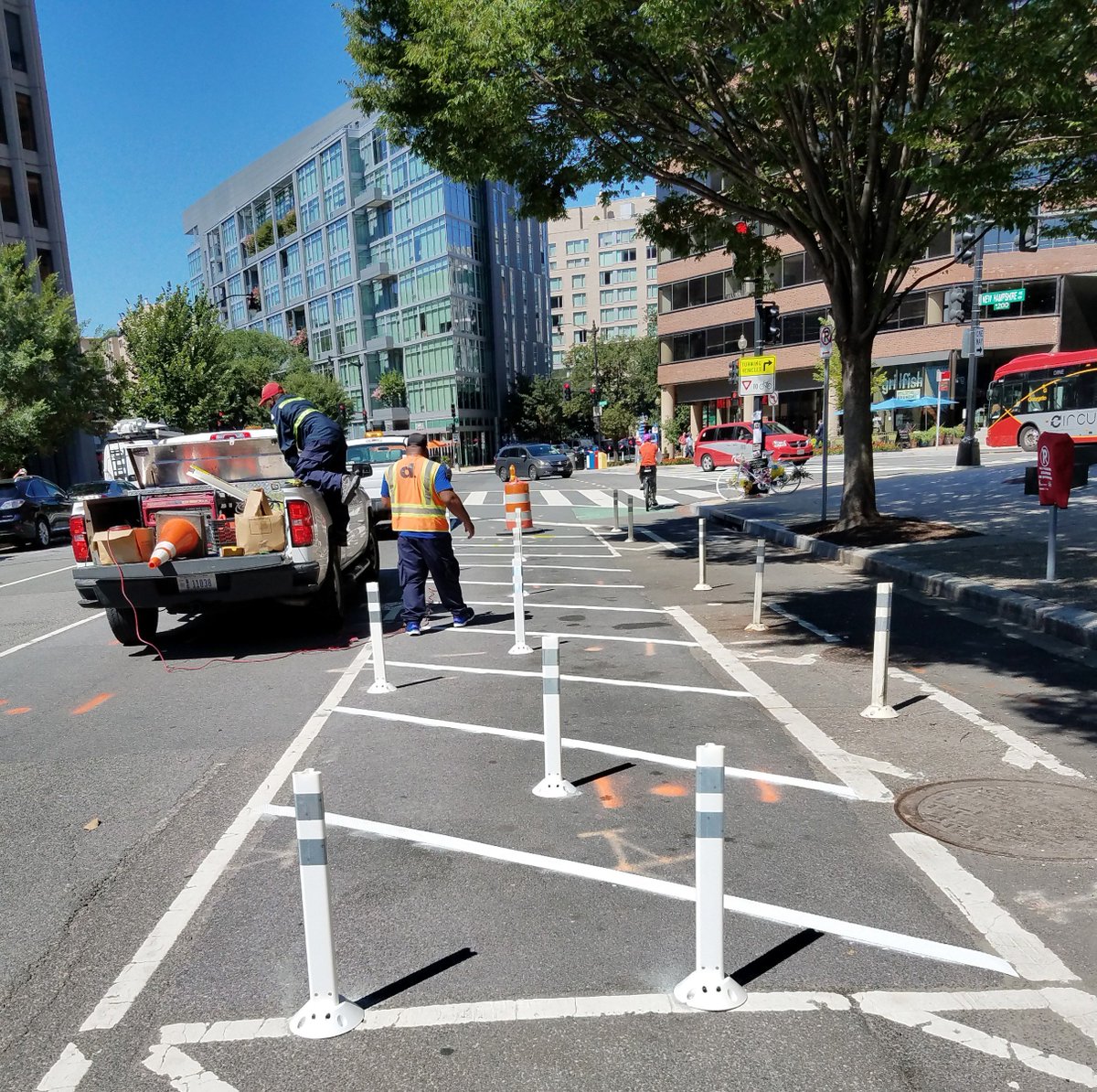 DDOTDC's tweet photo. We added safety bollards (flex posts) and pavement markings near the intersection of 21st St, M St and New Hampshire Ave NW today in a continued effort to increase traffic safety at this location and protect bicyclists and pedestrians. More safety upgrades to come. https://t.co/aEjomv5byz