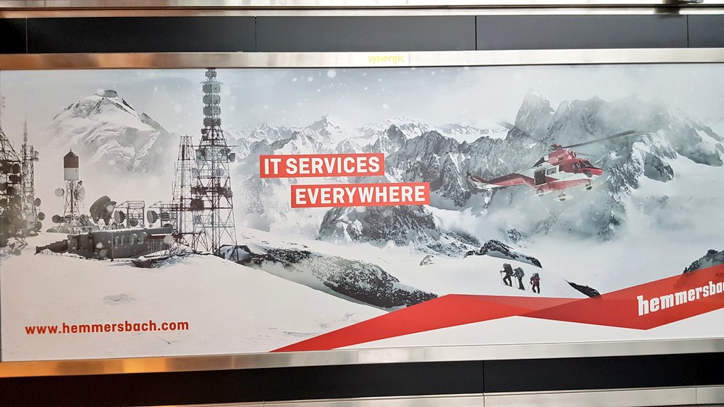 a billboard in the airport with an ad saying "IT services everywhere"