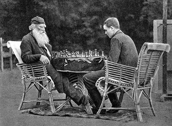 Leo Tolstoy playing chess with the son of Vladimir Chertkov who took this picture, 1907