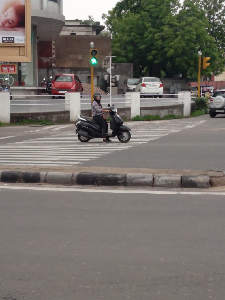 livepride_org's tweet photo. I was crossing the road she stopped at the pedestrian crossing. I  requested her to go back to the stop line. She agreed but doesn't move back. So I took her picture. At Satish Circle, Govt. Press, C-Scheme, Jaipur at 12:30 PM. @jaipur_police @traffic_jpr #StopbeforeStopLine https://t.co/nJXhVToFkd
