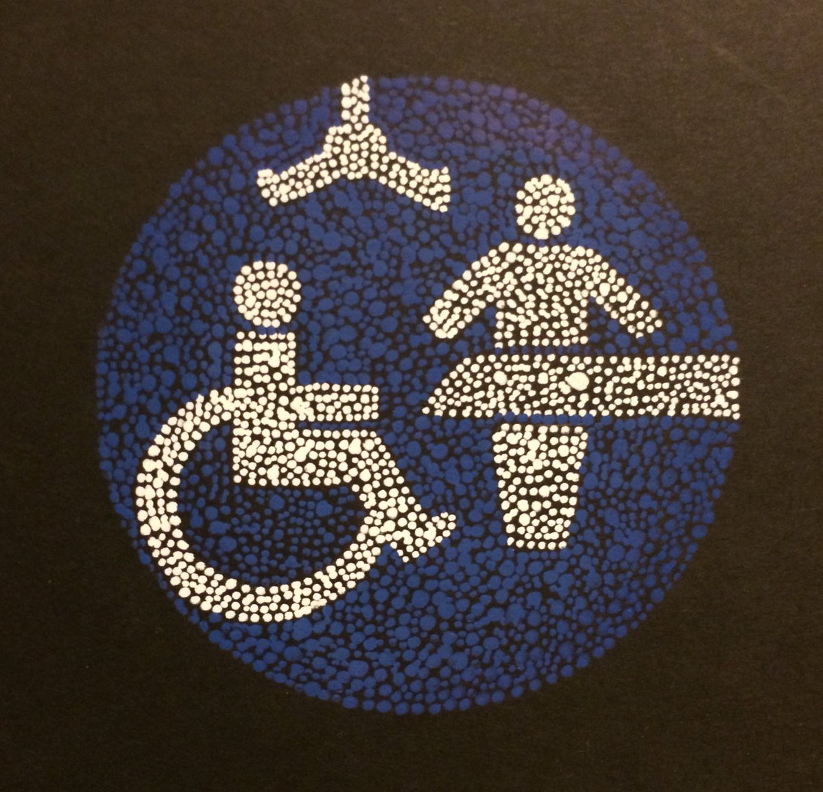 ‪ The Changing Place logo depicted in dots, using the same colours, on a black background. ‬