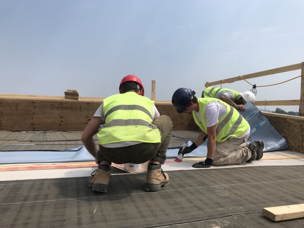 teammontreal's tweet photo. Working on the roof is extremely hard in this heat. We have to take 3-4 hour breaks during the afternoon but we are getting there! Half way through construction #day11 today. #solardecathlon2018 #teammtl #hardworkers #warriors https://t.co/poBY4irar3