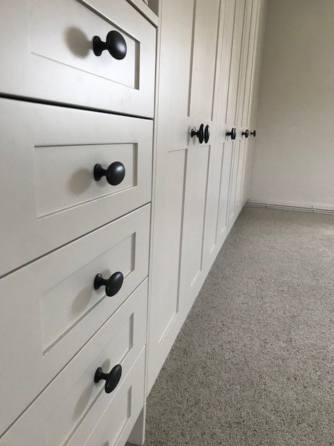 Wardrobes and drawers made and fitted, Oak Mfc Cabinets, Mdf Shaker doors made in our workshop, painted in Little Green - Limestone, with Furnipart Black oval Knobs.