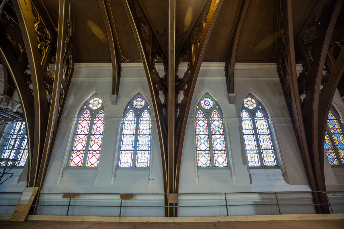 As restoration work continues, gilding (on the left) is slowly replacing the existing red trim (on the right) on the arched trusses which will help brighten and highlight the beautiful woodwork at the Cathedral of the Holy Cross.