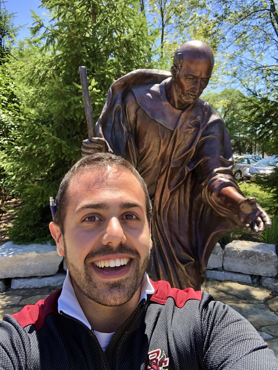 MatthewRazek's tweet photo. It took 10 years, but I’m finally halfway there! 14 U.S. #Jesuit Universities down and 14 to go. Traditional #SelfieWithIggy to commemorate. #JesuitEducated #AMDG #IgniteYourMagis #NJSLC2018 https://t.co/2x8yvrW4gb