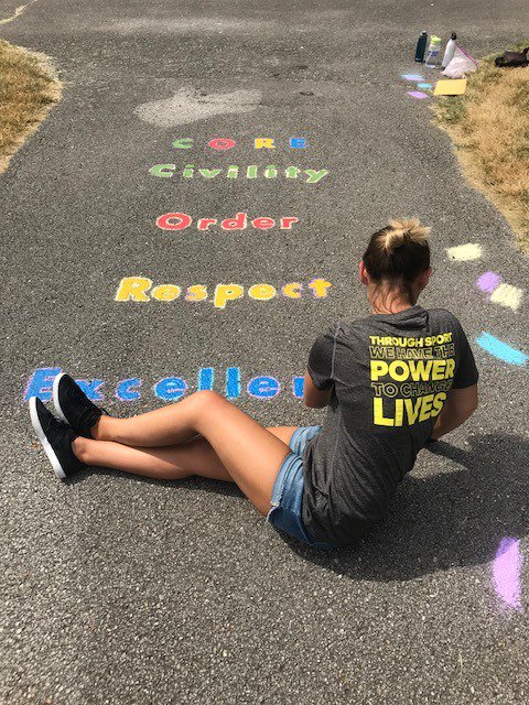 PlayworksIND's tweet photo. High fives all around for the more than 50 @adidasINDY volunteers that joined us @sunnyheightsele today to help them get their play space ready for their first Playworks Coach this coming school year! #MonthofPurpose #playINDY https://t.co/nEKxpBbdfr
