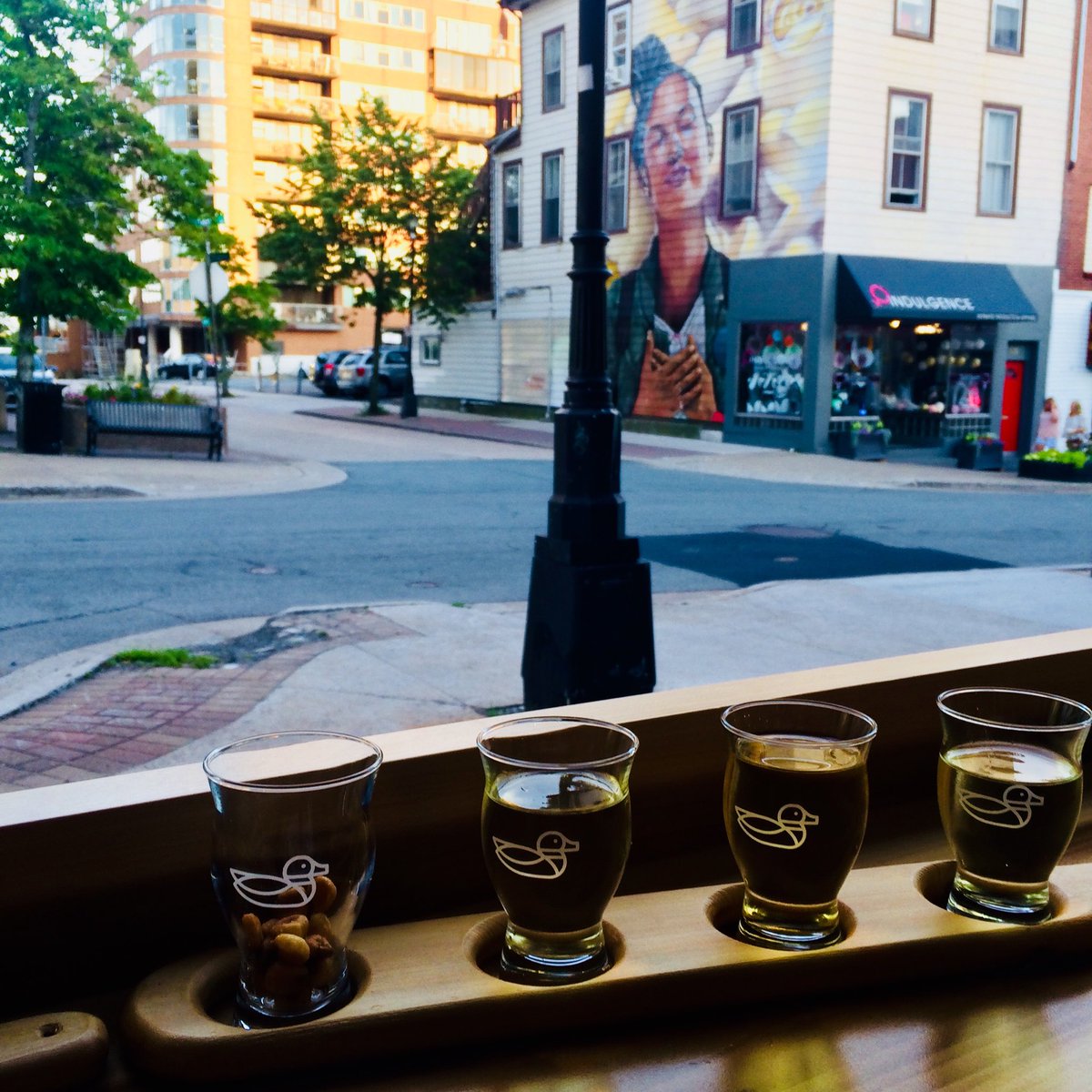 Enjoying the summer evening and the window bar seat at Lake  City Cider.
