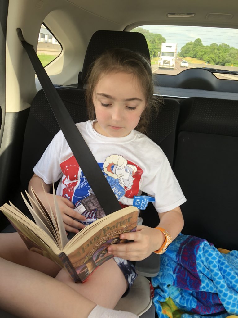 imatchr_marie's tweet photo. Taylor is reading the Harry Potter series for the second time...on the car ride to Hershey Park with Flat Ronny looking on. @HowellTwpRamtwn #RamtownReader https://t.co/z5OYAnkYS9