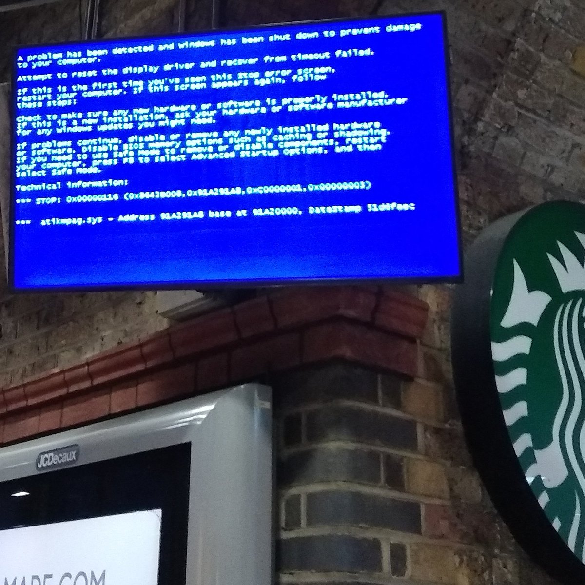 Blue Screen of Death at the train station. Lots of people standing around like zombies blinking at the blue screen unable to work out how to get home. It's like The Grid has gone down. When someone reboots the PC running Windows 95, none of them will remember a thing.