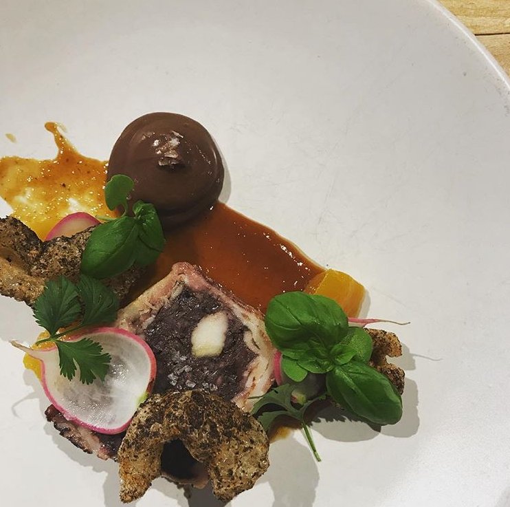 Terrine of Blood Pudding, Peach Butter, Pickled Peaches, Molé Seasoned Pork Rinds, Whipped Mexican Chocolate, Radishes. Dish by Holden. #gunshowatl #reigninblood