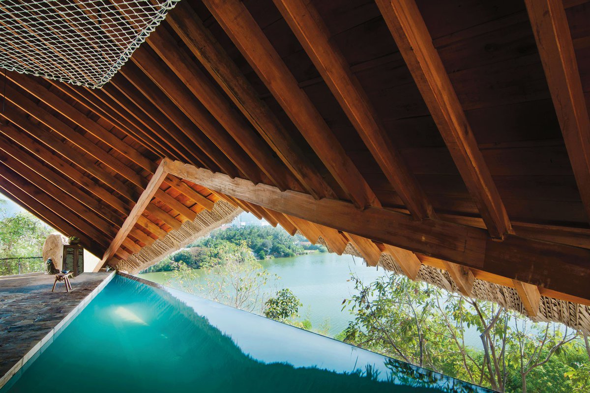 cntraveller's tweet image. #MondayBlues at this Vietnamese infinity pool, crafted from locally sourced wood, stone and coconut leaf and overlooks Nha Trang’s tranquil Cái River. #pooloftheweek #infinitypool #swimmingpool