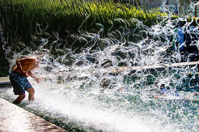 JimWatson_AFP's tweet photo. A child jumps through a waterfall at Yards Park. #weatherfeature #slowdayatwork #waterfall #waterpark https://t.co/BdNVntHnGJ https://t.co/30vN9gMBDk
