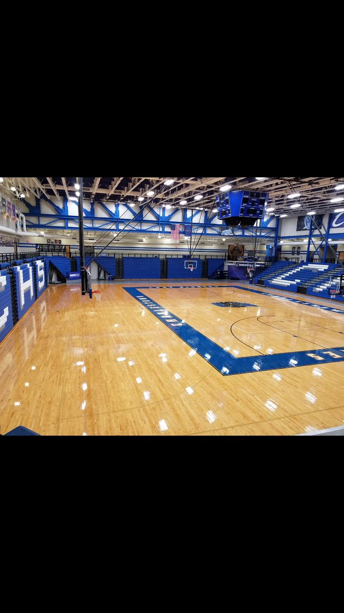 While we have been enjoying our summer, our custodians have been hard at work... gym floor looks amazing!