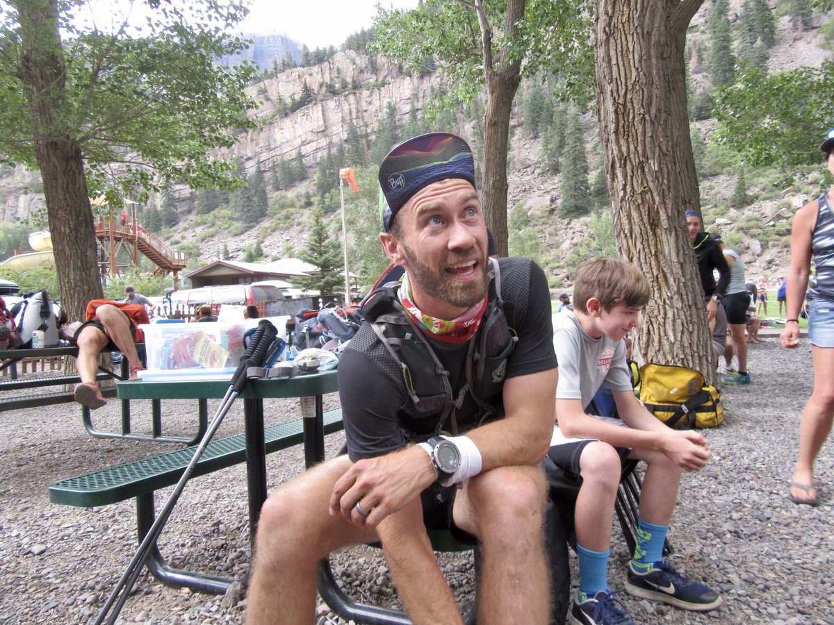 iRunFar's tweet photo. Ben Bucklin arrives at mile 44 in fifth place in high spirits (+91’). He is greeted by his wife (two-time hardrocker). Drinks a ton of water and moves quickly out of aid. Makes up a few minutes on fourth. #HR100 https://t.co/qtxnSWRE8S