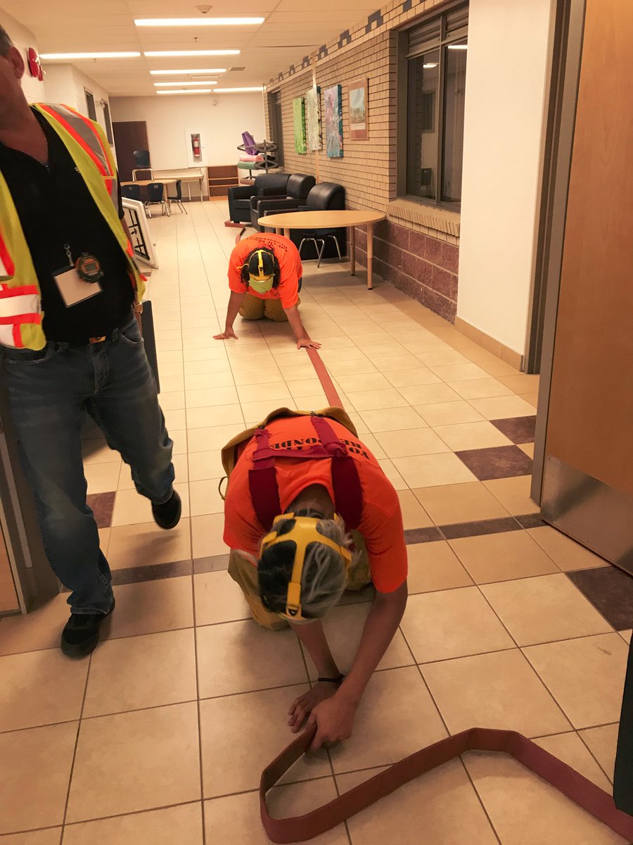 SaskMiningAssoc's tweet photo. For #Search&Rescue event #YouthResponders had visors taped to simulate low visibility in smoke-filled room. They crawled on floor, feeling walls and hose to rescue #FakeChild- #GreatCommunicationCaptain @SaskatoonFire @SSRMining @StoonTribalCncl @whitecapschool https://t.co/OPd8gHjV7x