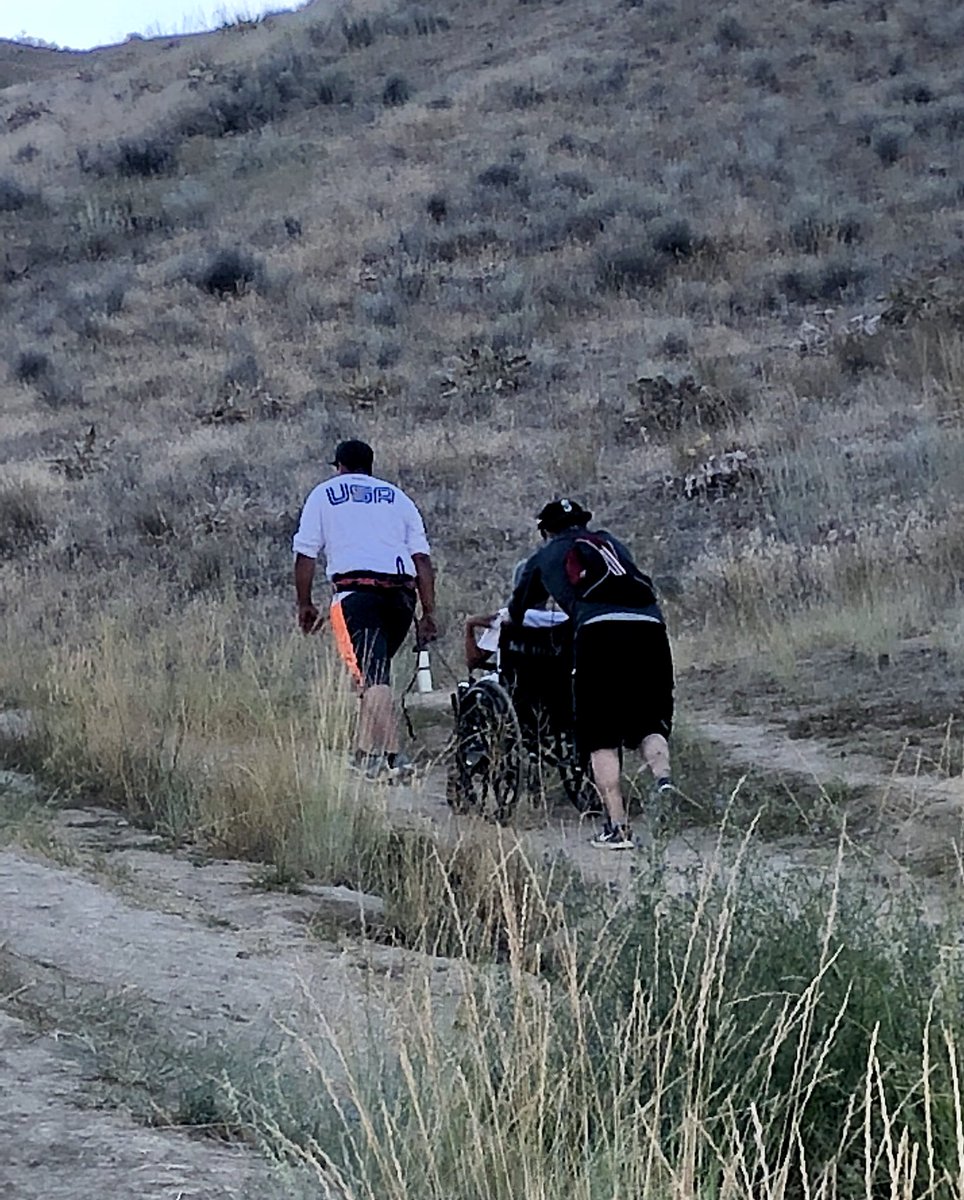 MomentumNut's tweet photo. @realDonaldTrump Hispanics towing their wheelchair bound brother up a mountain just so he could see the view.  Wearing a USA shirt.  #nowall https://t.co/c8Uow6kj60