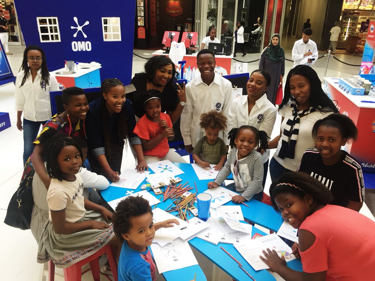 OMOSouthAfrica's tweet photo. You’re invited to join us at the OMO Gallery of Stains in Baywest Mall, Port Elizabeth today. Pop in NOW until 1pm for some great fun activities with @zolanimahola. You can also pledge to #WashLessLiveMore with your hand print. 🎨🖌 https://t.co/BW803IeQhb