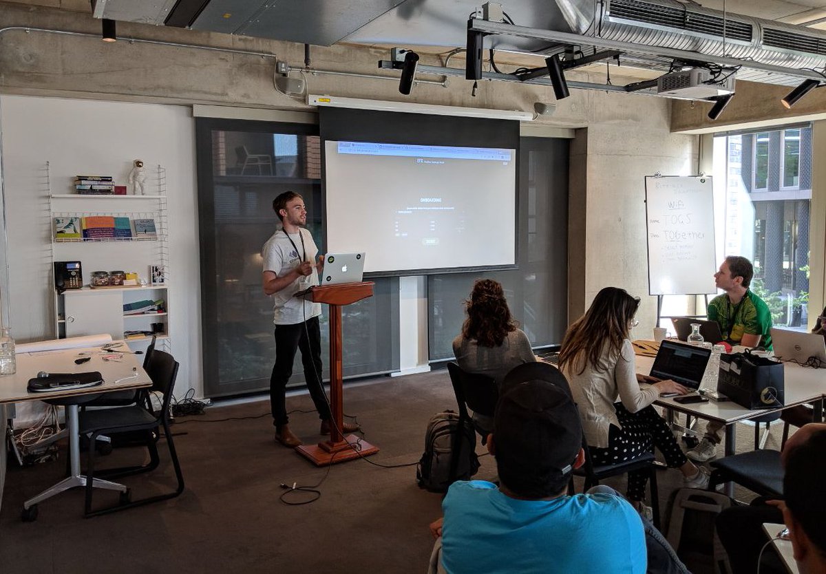 rhinofi's tweet photo. Will Harborne unveiling our developer tools for non-custodial, Ethereum-based trading. 

We're now just a few days away from presenting our users with a highly liquid order book, tradable without having to sacrifice control of what's yours. Stay tuned 👀#bitfinexhackathon https://t.co/KETgLRGQYn