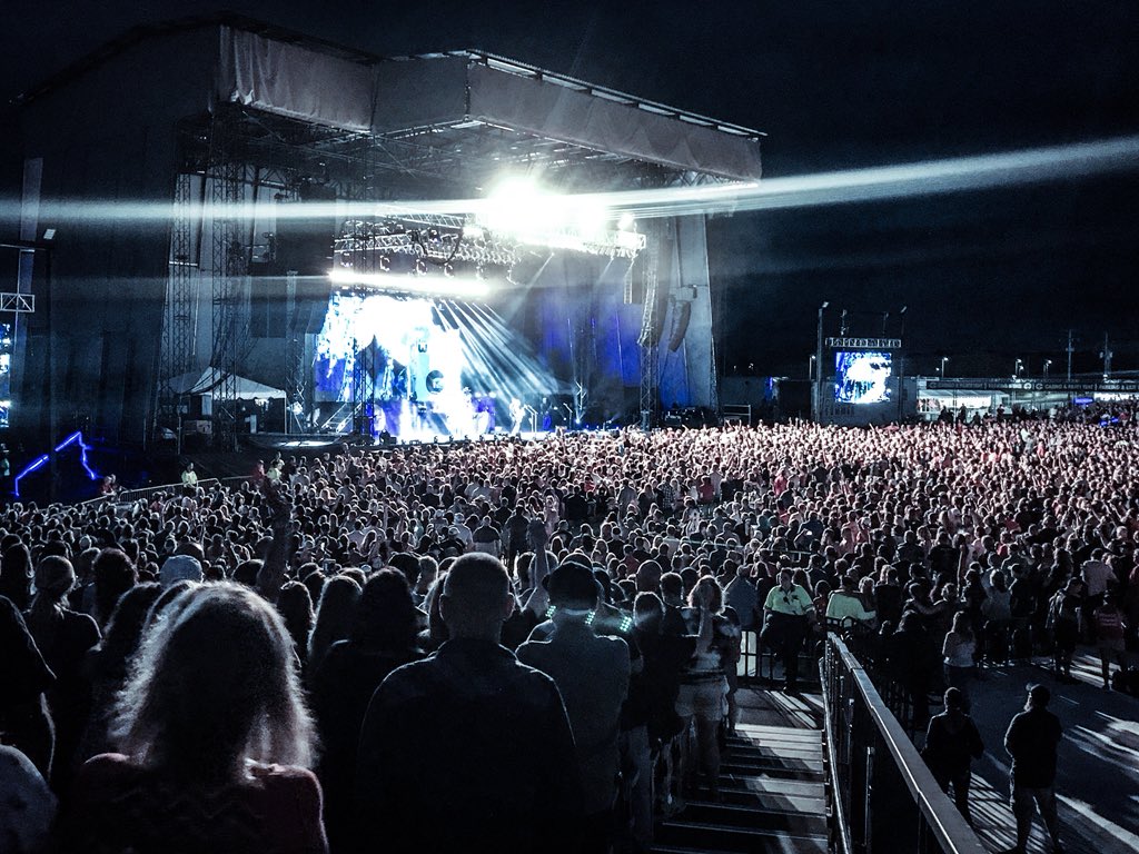 Nickelback's tweet photo. Mt. Pleasant - until last night, we hadn’t had the good fortune to spend an evening with you all and kick a whole in the sky together.  100% rectified!  Thank you for being there with us. You were incredible! We’re already looking forward to next time!   #NBMI https://t.co/wvCR3S9cfg