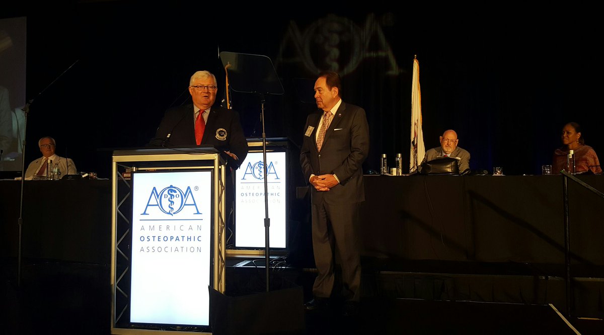 Clint Adams, DO, receives a Presidential Citation from AOA President Mark Baker, DO #AOAHoD