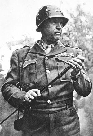 Another ardent fan of the selfie was, unsurprisingly, General Patton. Here he has slung his phone over his shoulder to access a small compartment in the stick. Although it's often claimed Patton modified it to contain a blade, in fact it held a small microfiber cleaning cloth.