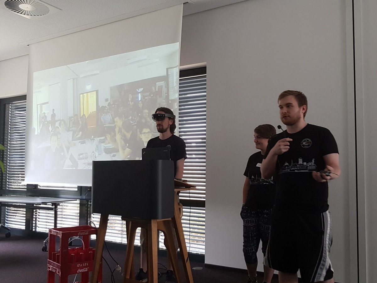 dohack_io's tweet photo. Team "AR Cookie Factory" presenting their idea about playing the game "Cookie Clicker" in #VR with the #Microsofthololense at their #1st #Hackathon @adessoAG #DoHack2018 WOW!!! https://t.co/pqkyicR7EM
