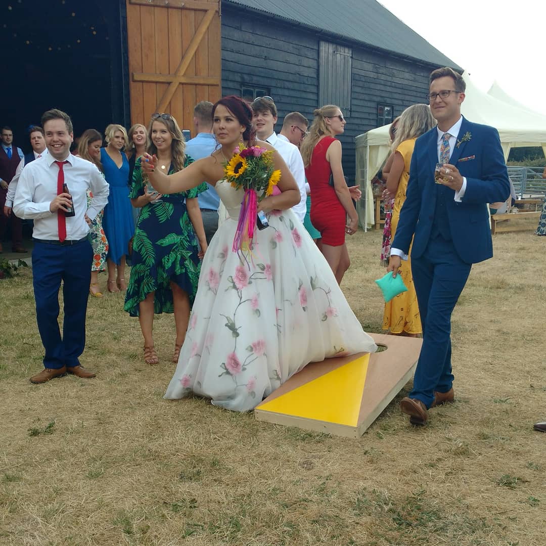 Cornhole makes a summer wedding! Great for guests, grooms and brides alike! #cornhole #brideandgroom #wedding