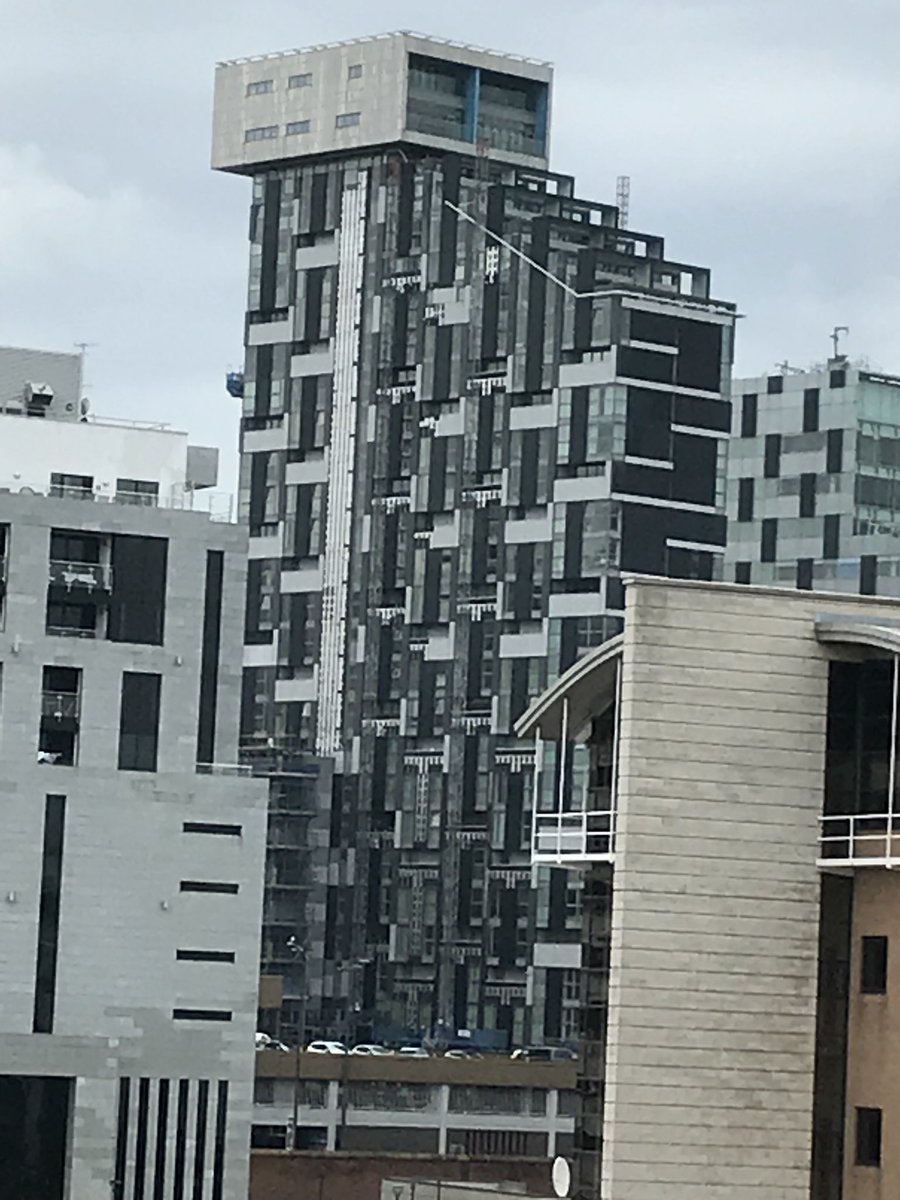 In Liverpool. Gazing at this dockside building with its ludicrous top-knot and wondering why we slap up these horrible buildings and blight our riversides. Then there’s London and the Thames...