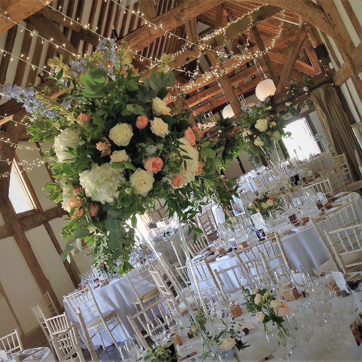 LoseleyPark's tweet image. Stunning set up in our #tithebarn at @LoseleyPark with floral arrangements in very tall vases for that &apos;WOW&apos; factor! More again from this gorgeous #weddingreception coming tomorrow!