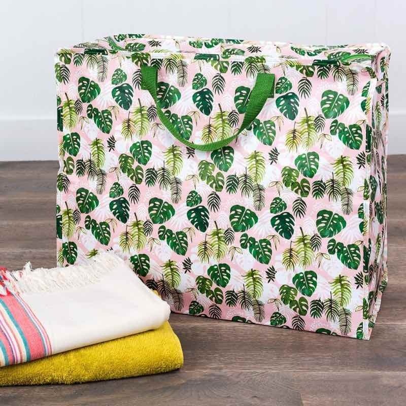 Mantén tu casa ordenada con esta bolsa de almacenaje con un bonito diseño de hojas de palmeras