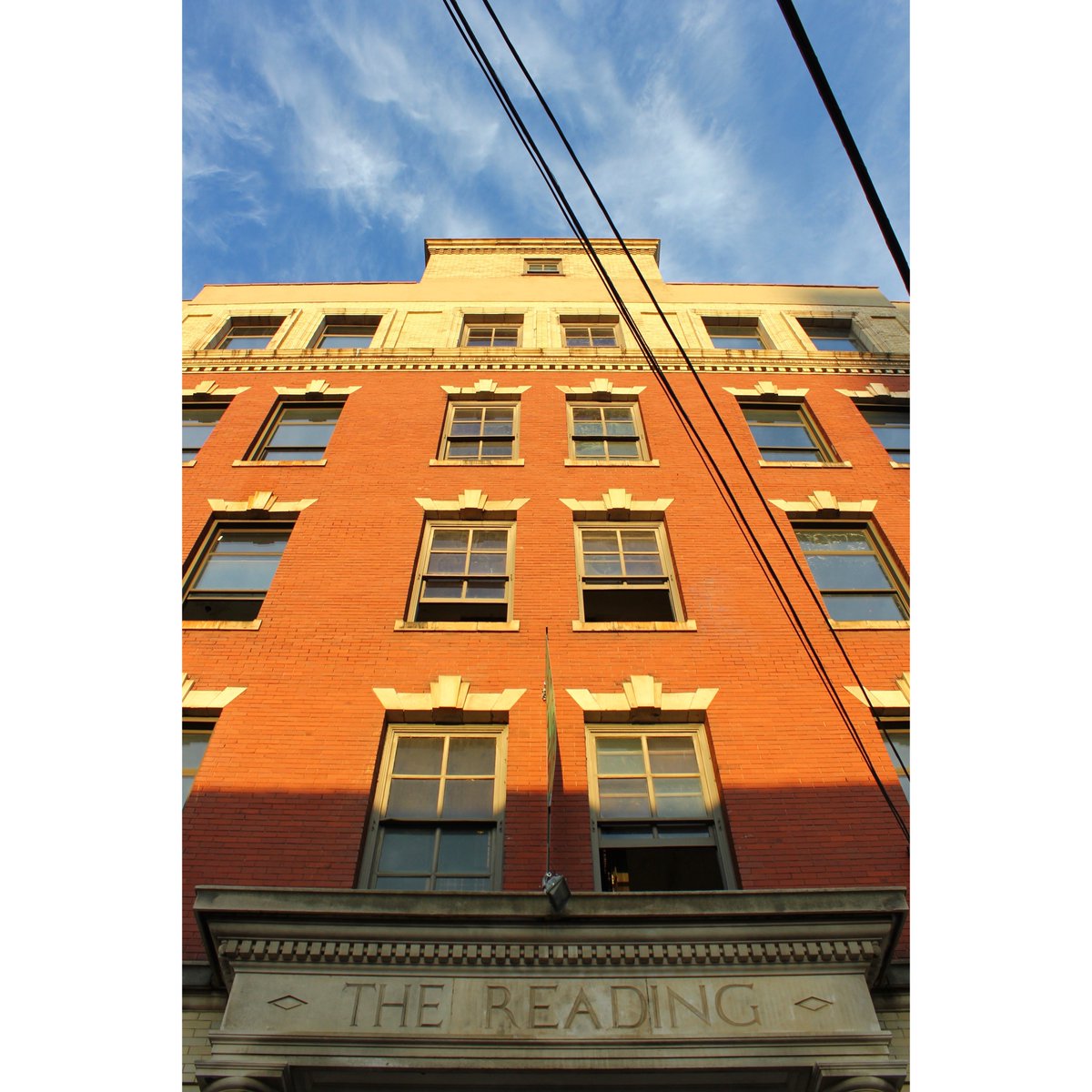TripleBottomCo's tweet photo. Sending you all some sunshine on this rainy #Monday. This glowing photo of our building is our motivation today. Our future home at 915 #SpringGarden once held the offices of the #ReadingRailroad. We’re excited to be part of the next phase of this building’s history. 💫 https://t.co/WA5jJvpAdv