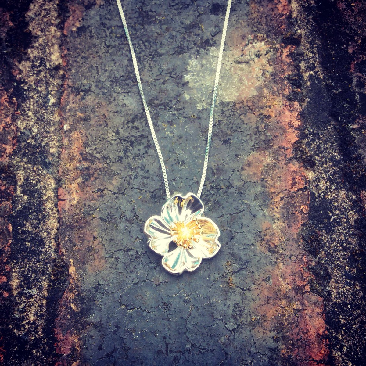 HarrietAndDee's tweet photo. Polished silver and vermeil flower pendant. A great design from our friends at #azendi https://t.co/eH7oKRegd1