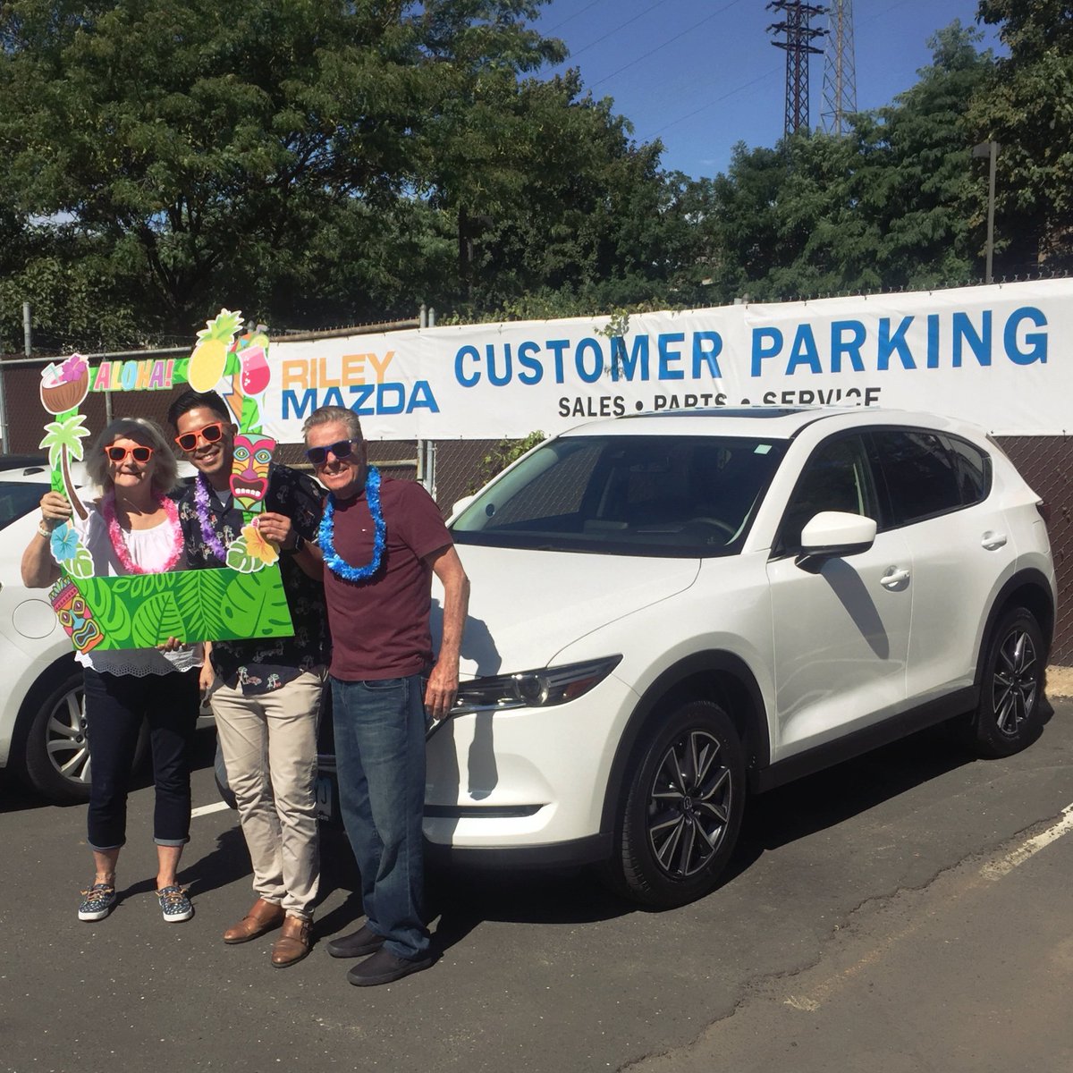 RileyMazda's tweet photo. Congratulations to Barbara who just picked up her brand new 2018 Mazda CX-5 and joined in on the tiki spirit here at Riley Mazda with RJ. Best wishes and safe travels across the country! #rileymazda #mazda #cx5 #harborpoint #stamford #tiki #party https://t.co/Jwb0pNOCA8