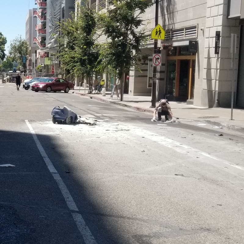ChrisGEdwards's tweet photo. A lovely but futile solo berkley human cleans up a trash fire as the protest goes on. I'm Arriving late to the Berkeley protest. Be safe, write the NLGs number on yourself #breaking #news #alloutbayarea #protest #resist #trashthefash #stopthehate #blm #blacklivesmatter #lgbt https://t.co/EL4wHArESf