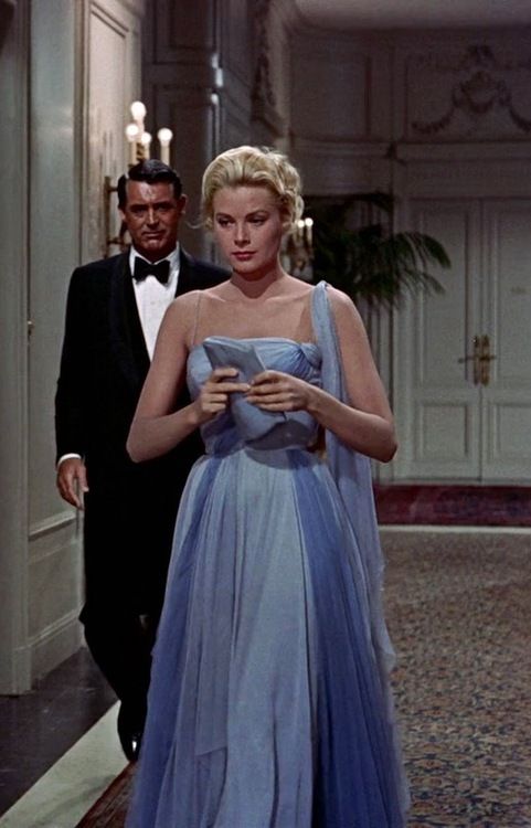 I have developed a new system for choosing the dresses I post. So when I  got a blue 1950s dress, I hit the search engines and found this beautiful  blue chiffon dress