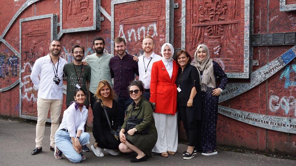 SafaKocoglu's tweet photo. Our participants have crossed through the peace wall onto the Shankhill Road. Our tour guide tells us that people want to see these walls come down but ‘not today’ @EUDelegationTur #peacewalls #peaceisaprocess https://t.co/bm1uBailVm