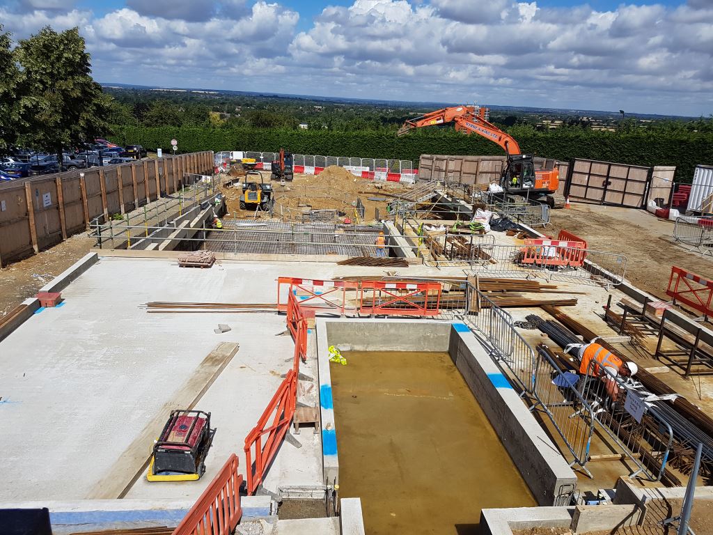 OUH_Estates's tweet photo. No, not a new swimming pool at @OUHospitals JR. This is the exciting progress of @medsci.ox.ac.uk new UK Stroke & Dementia Research Centre adjacent to #OUH_Estates Industrial Block. Completion Spring 2019. https://t.co/xGJGdRvG5M